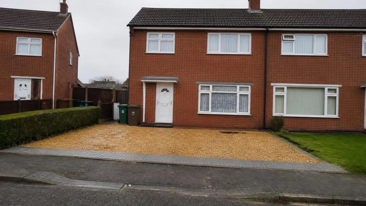 Ex-council semi in Hemlington with a gravel parking bay and a solid strip at the pavement edge